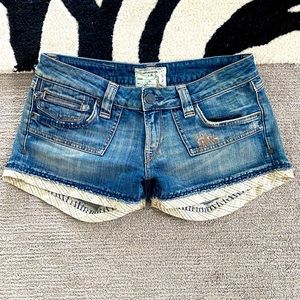 One-of-a-kind jean shorts with exquisite detailing!